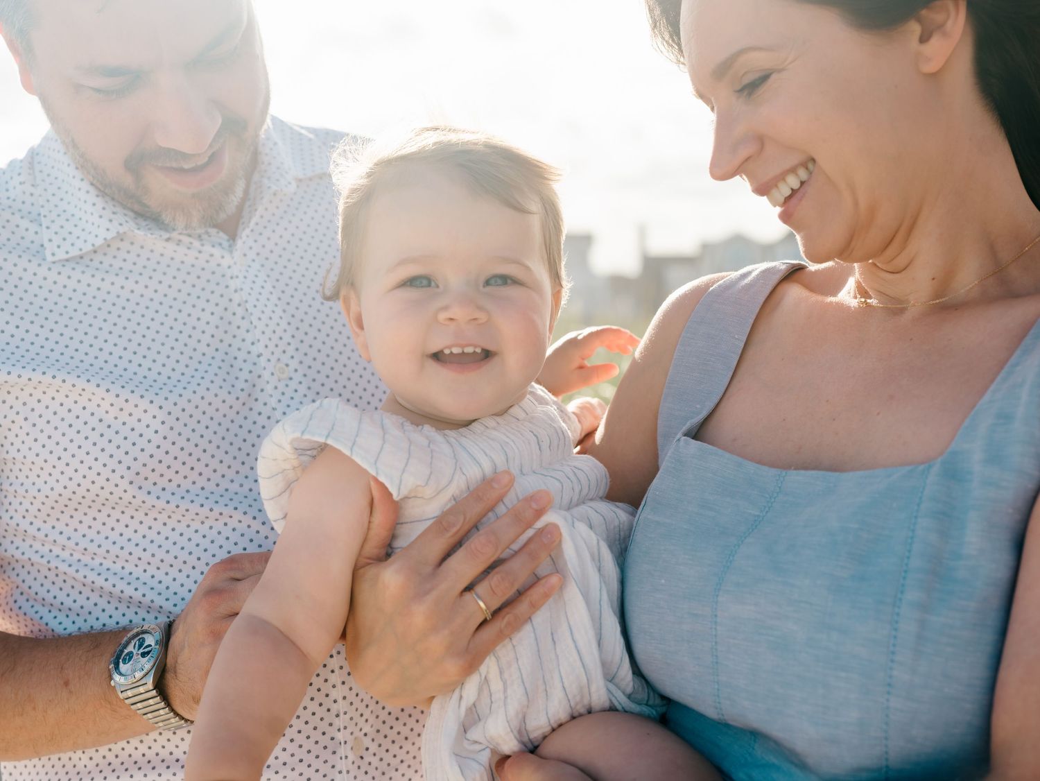 A close up picture of one year old girl with her parents on the beach in New Jersey.