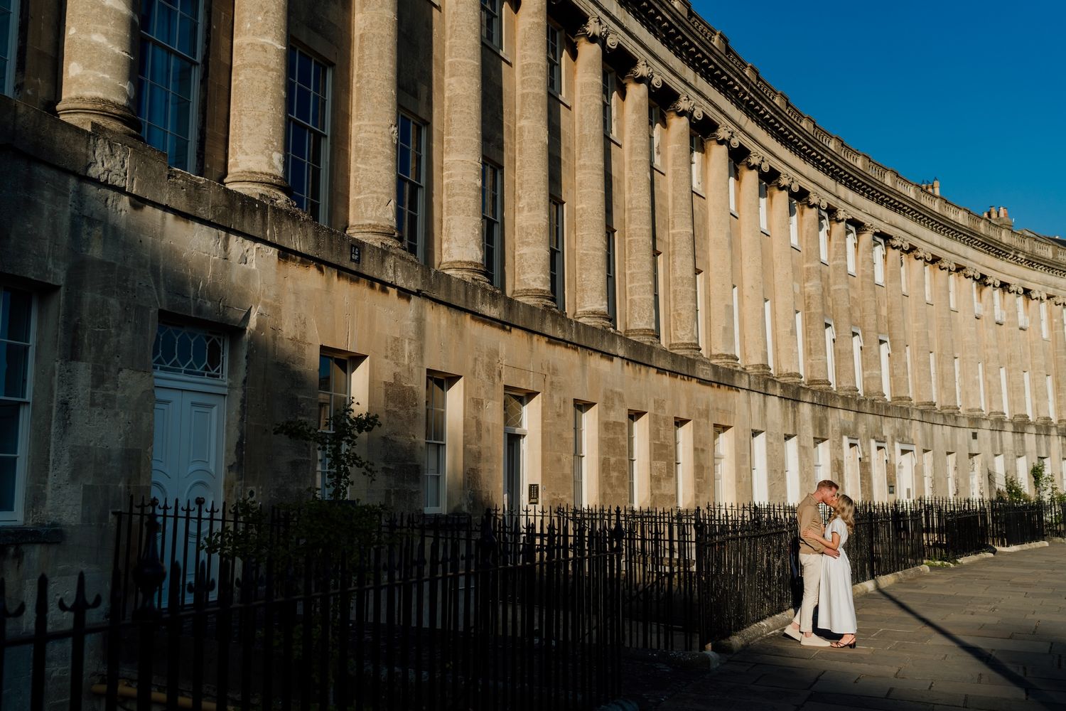 Historic Royal Crescent in Bath, England showcases elegant Georgian architecture along the sweeping curved terrace.