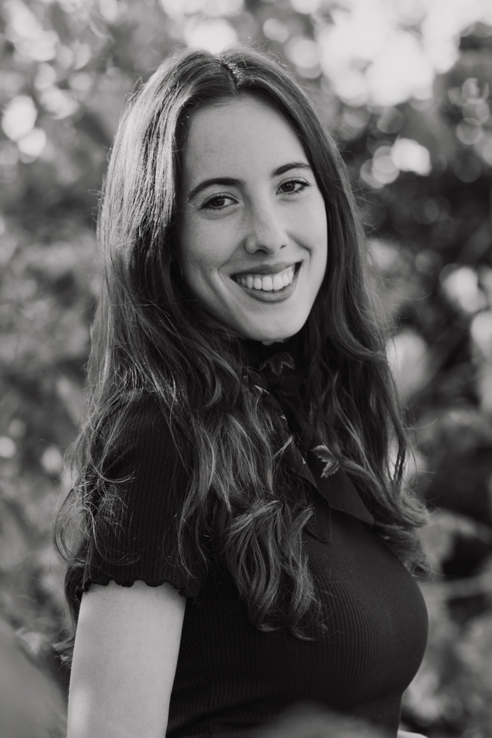 Black and white portrait sequence showing natural expressions and flowing dark hair.