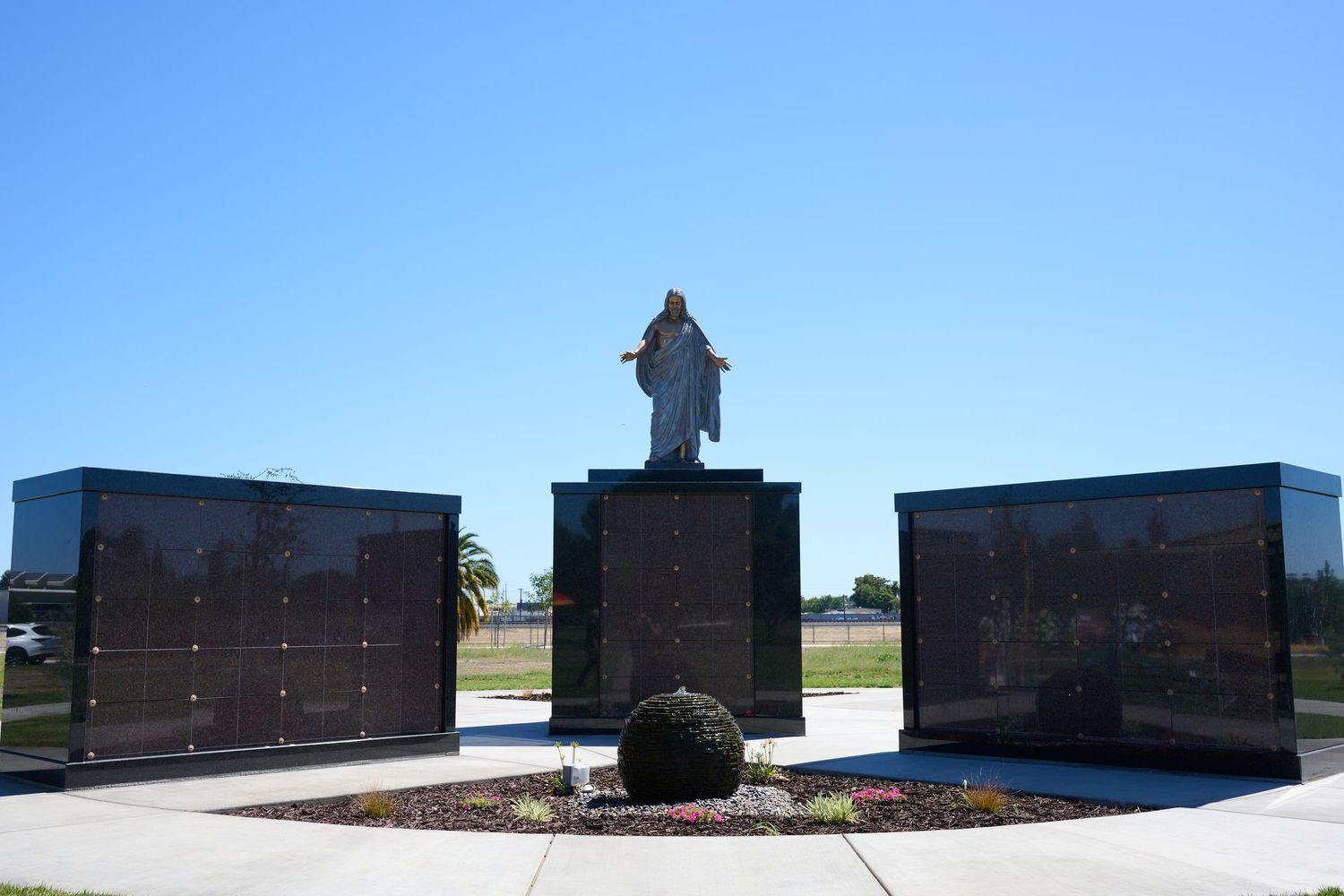 A collection of panoramic silhouettes of memorial monuments lined up against a bright blue sky background.