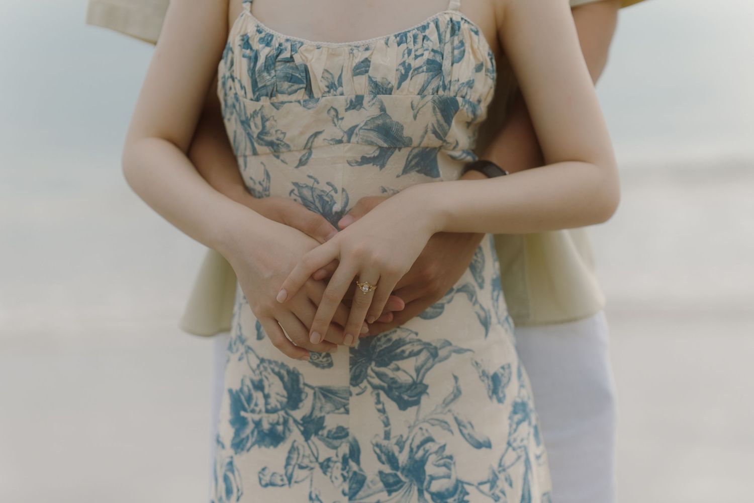 Intimate couple's portrait series showing gentle embraces in muted tones.
