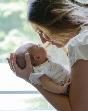 Series of intimate close-up shots showing gentle interaction with a baby.