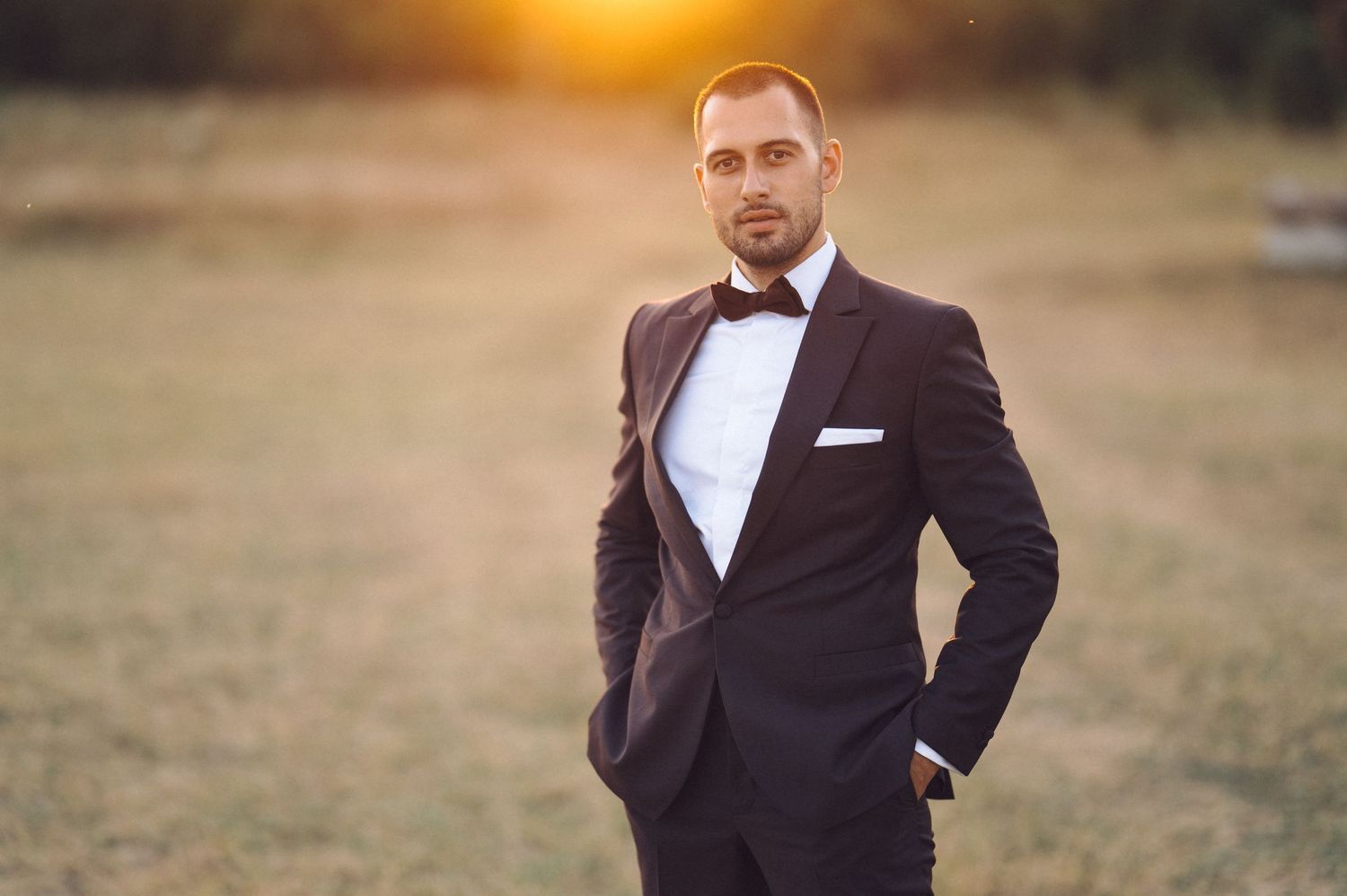 A collection of formal wedding photographs showing grooms posing outdoors at sunset in black tuxedos.