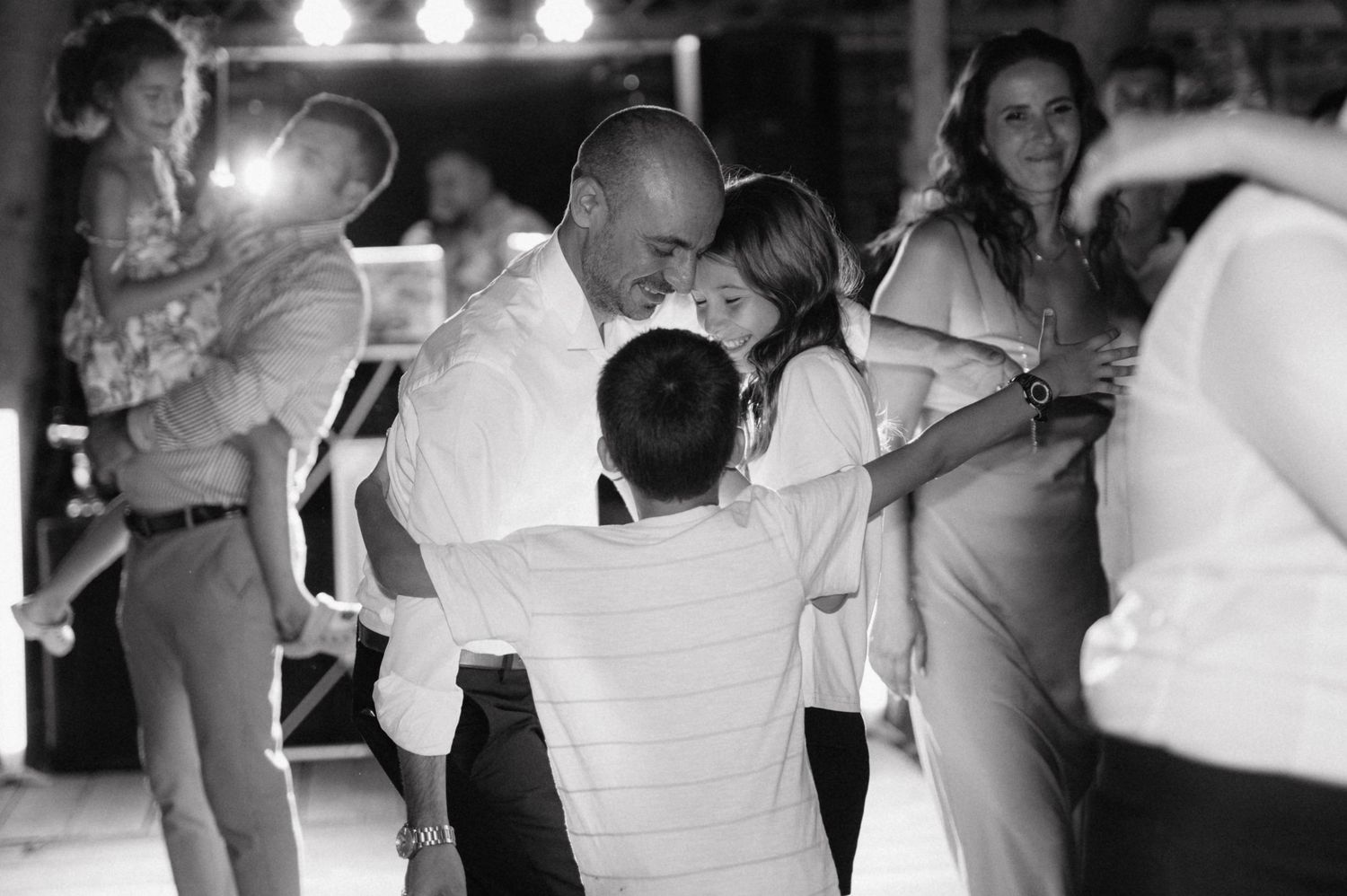 Monochrome wedding dance photos displayed side by side showing couples dancing and celebrating.