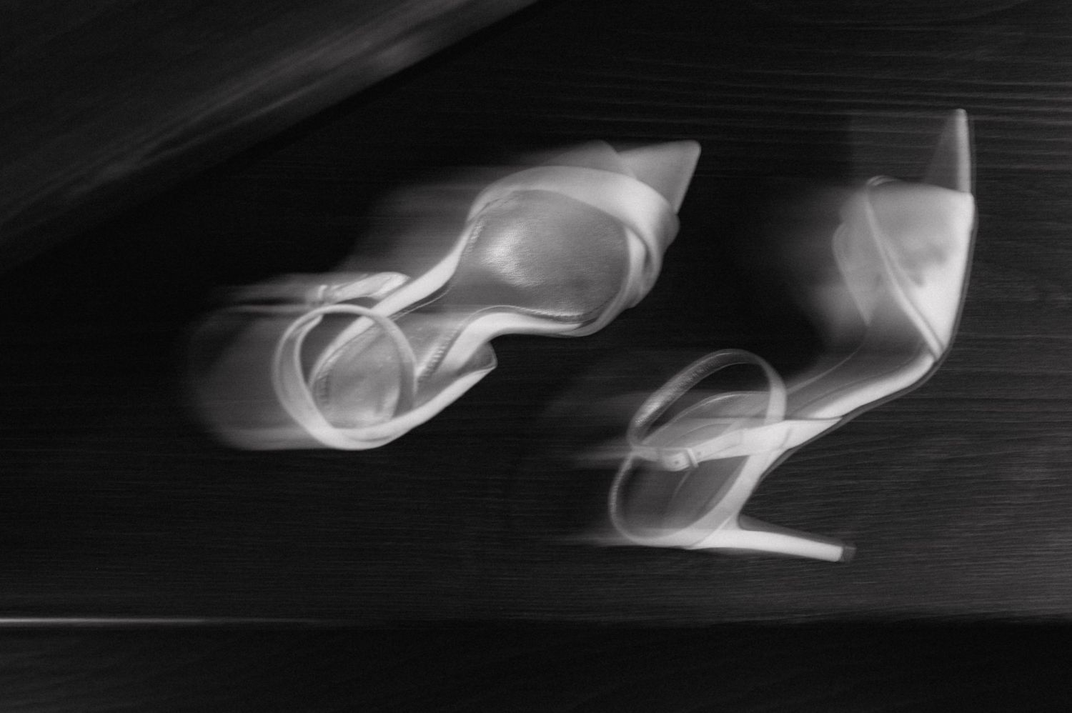 X-ray images of formal shoes shown in sequence across a dark background.