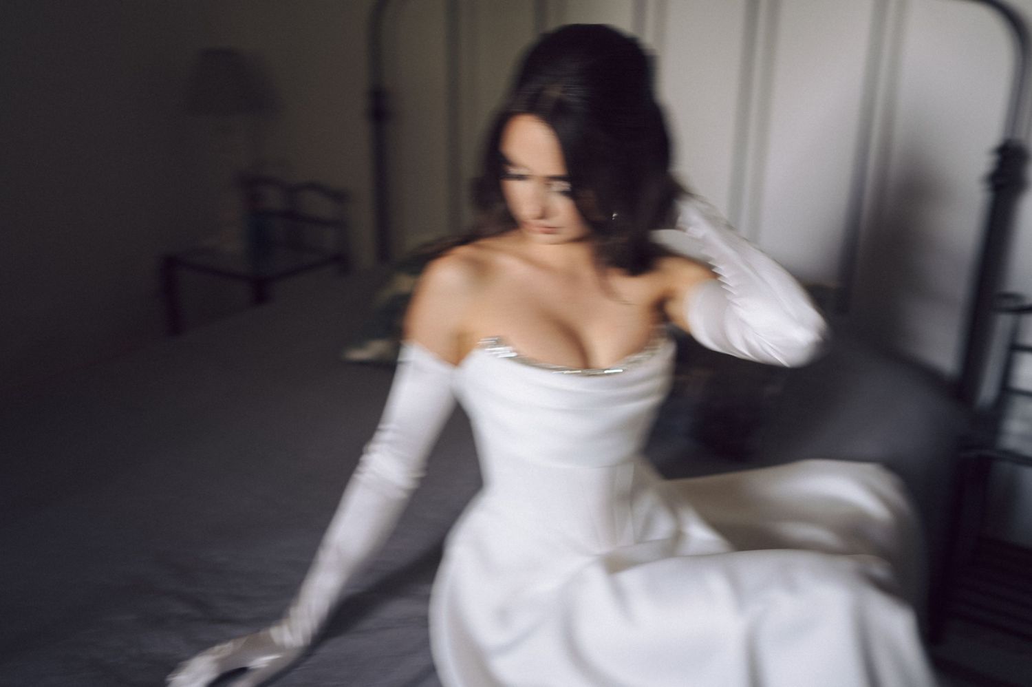 Seven horizontal images show someone in a white wedding gown spinning and twirling in a whimsical indoor dance session.