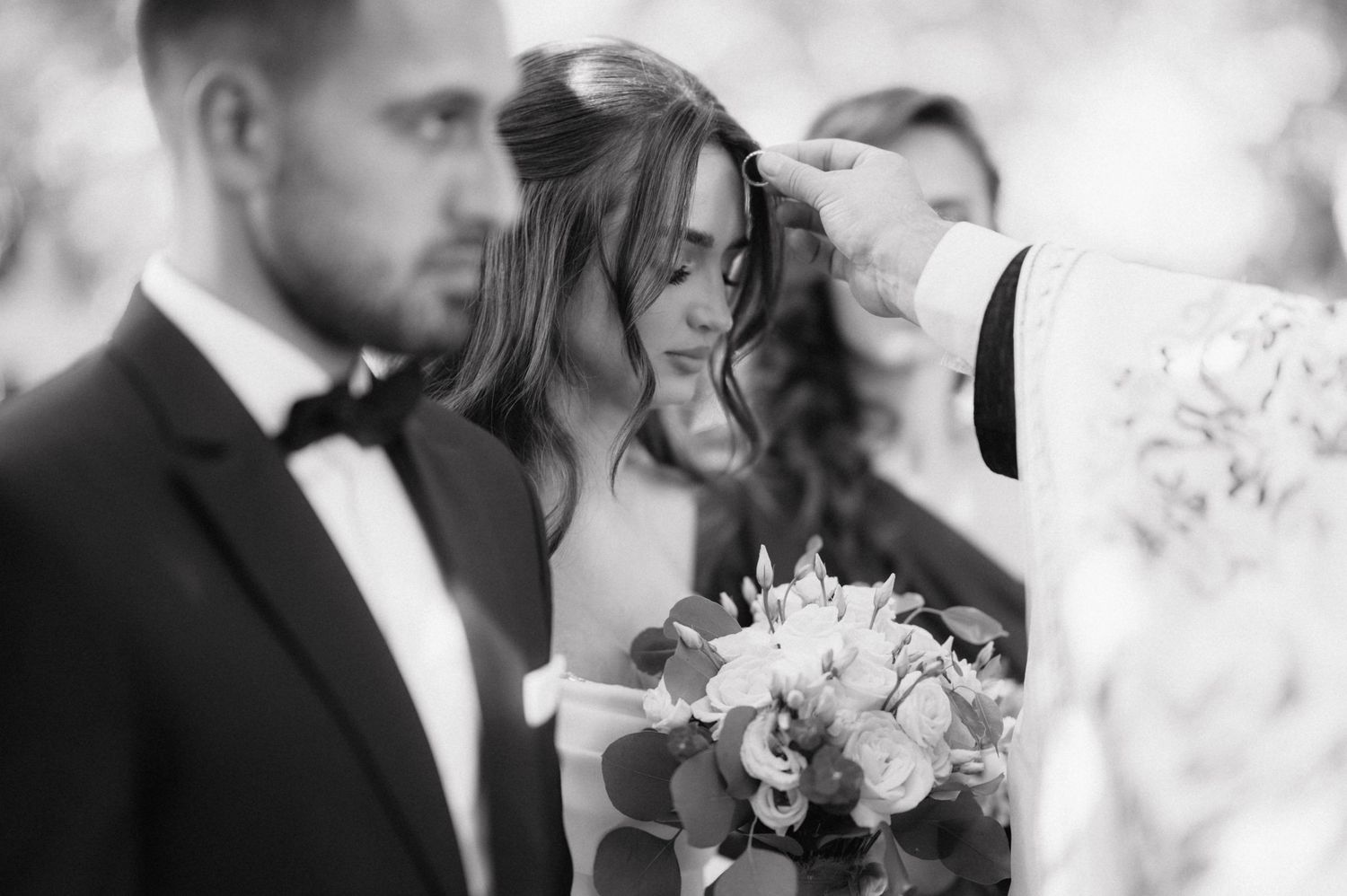 A romantic black and white wedding photo collage shows intimate moments between couples with flowers and formal attire.