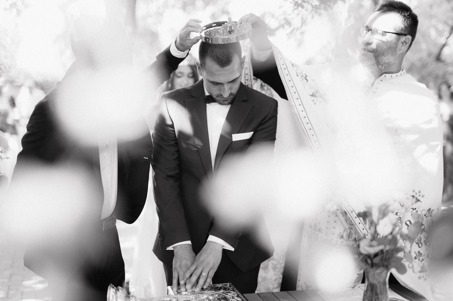 A black and white wedding photography collage with three romantic shots of the couple in their wedding attire.