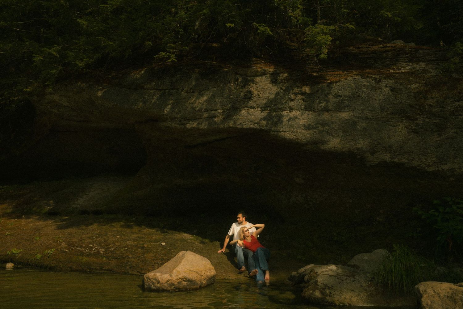 Rocky cliffs and cave formations in a dark natural landscape. couple photography, photographer, nh, 3rd hole