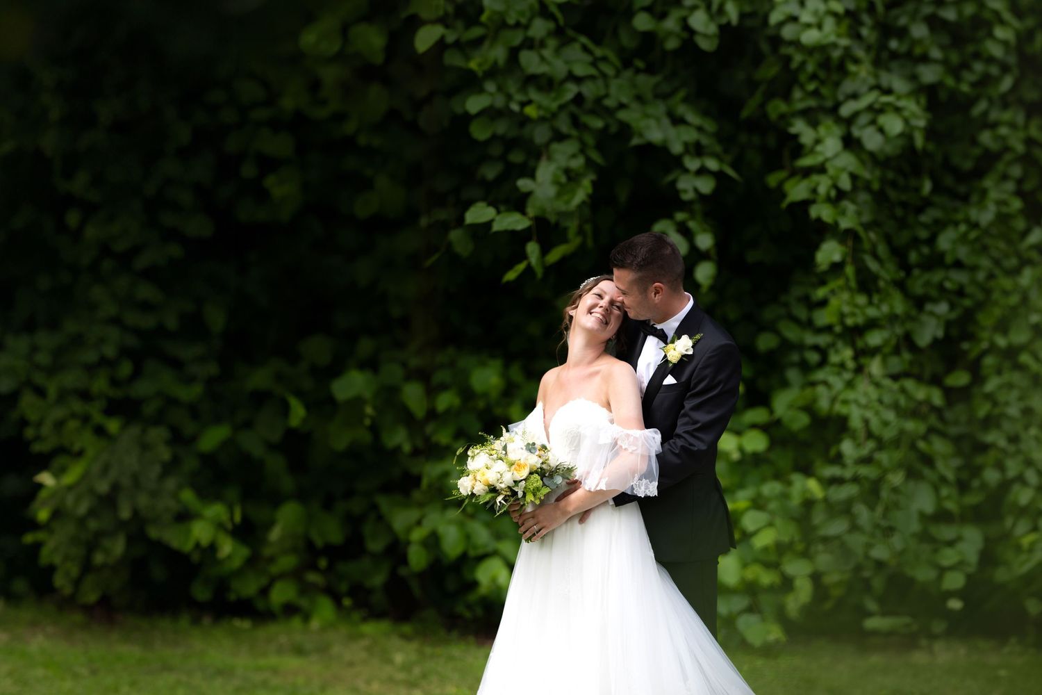 A romantic wedding sequence shows a couple in an outdoor setting sharing tender moments together in sunlit nature.