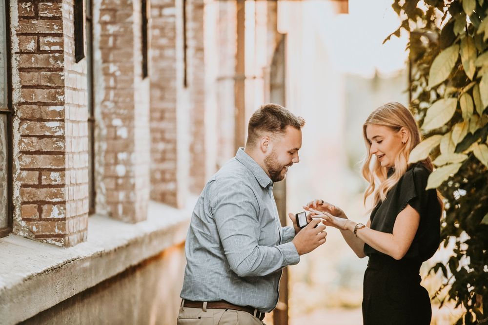 Couple sharing emotional moment during Cotton Mill proposal in Texas