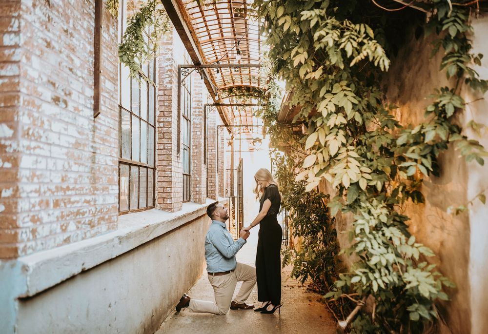 Nicholas and Brooke hugging after proposal at McKinney Cotton Mill