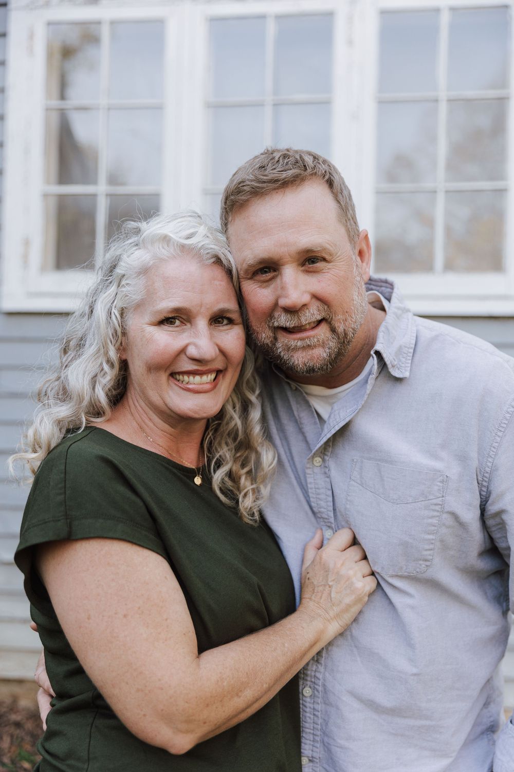 A couple in love share tender moments in a three-panel photo series against a white wall background.