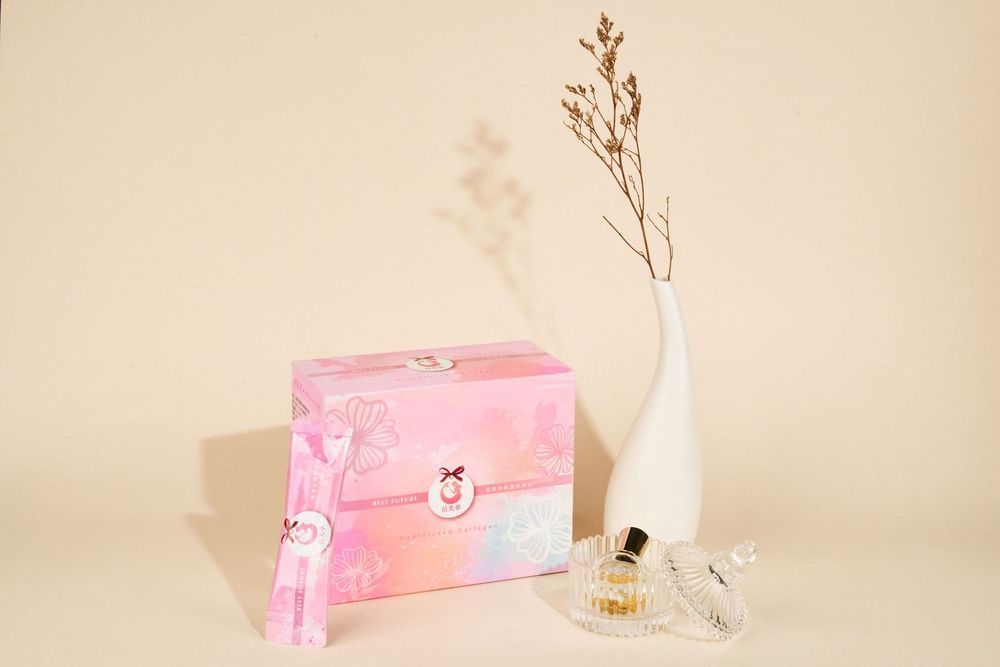 Elegant pink gift cards with floral motifs displayed against a neutral beige background.