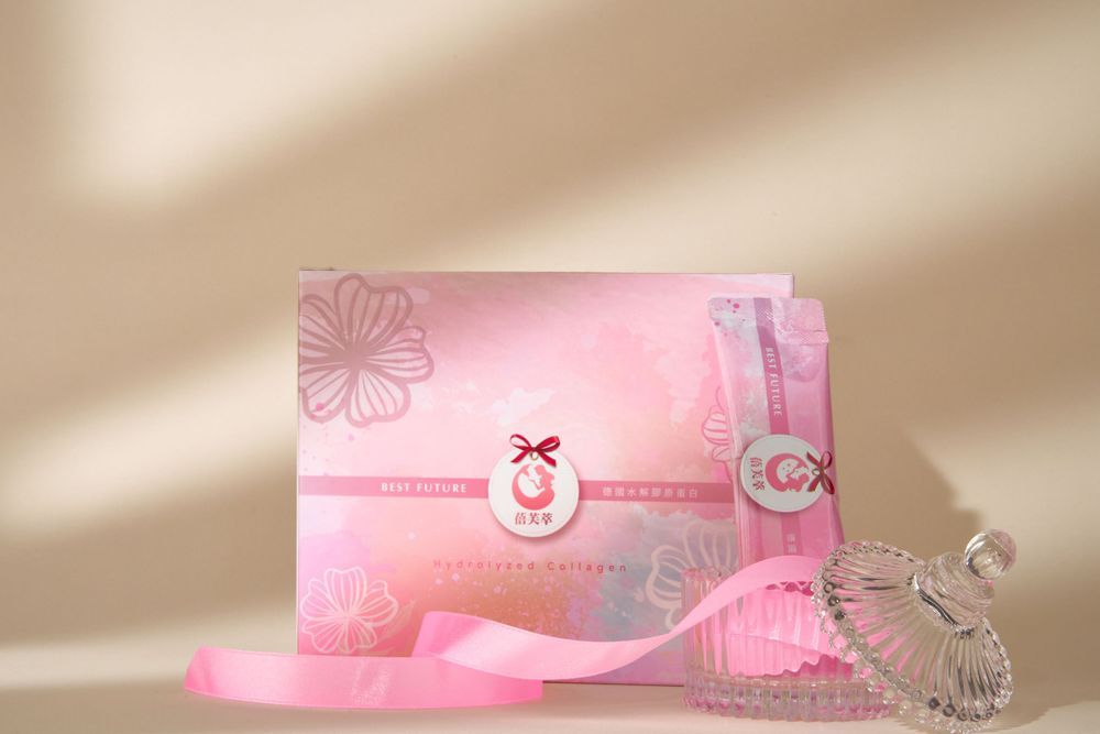 Pink paper products and stationery arranged in a minimalist layout with natural window lighting.