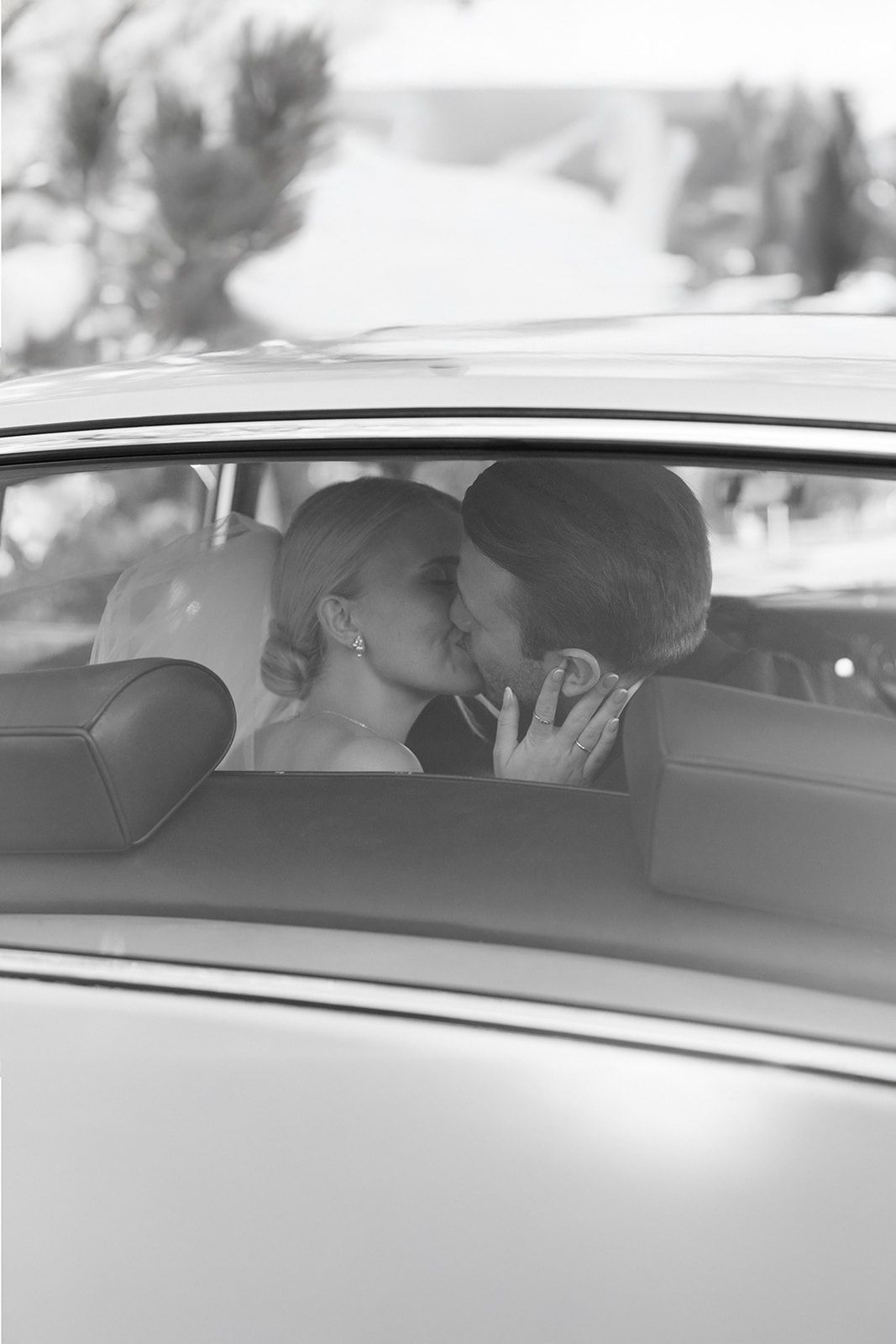A black and white photo sequence showing a car interior with passengers viewed through the windshield.