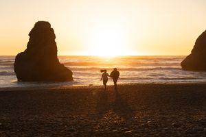 Dramatic sunset silhouettes at Ruby Beach in the PNW, captured by Savvy Photography - Seattle Wedding Photographer