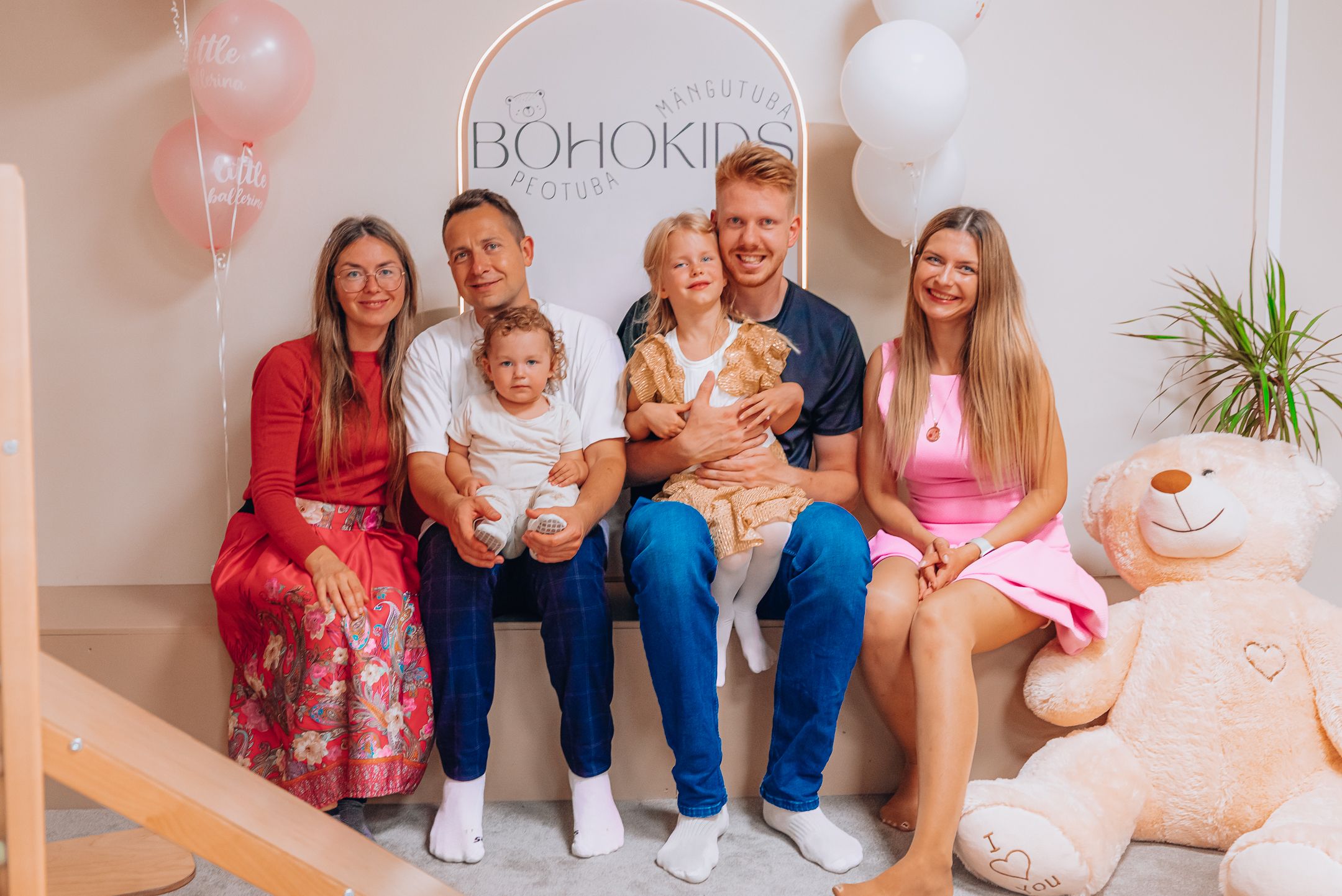 A collection of family portrait photos showing people sitting together on a couch in coordinated outfits.