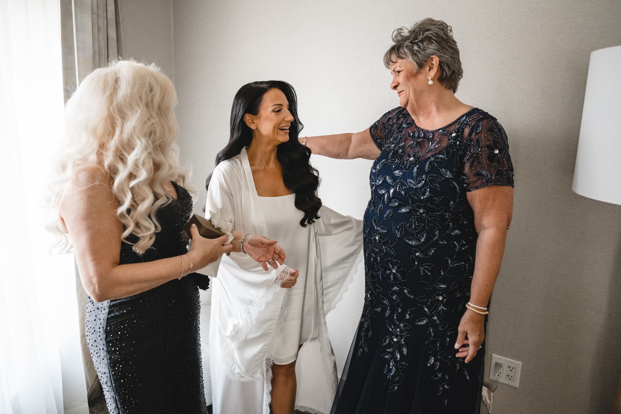 Wedding preparation scene with formal attire in a modern room setting.