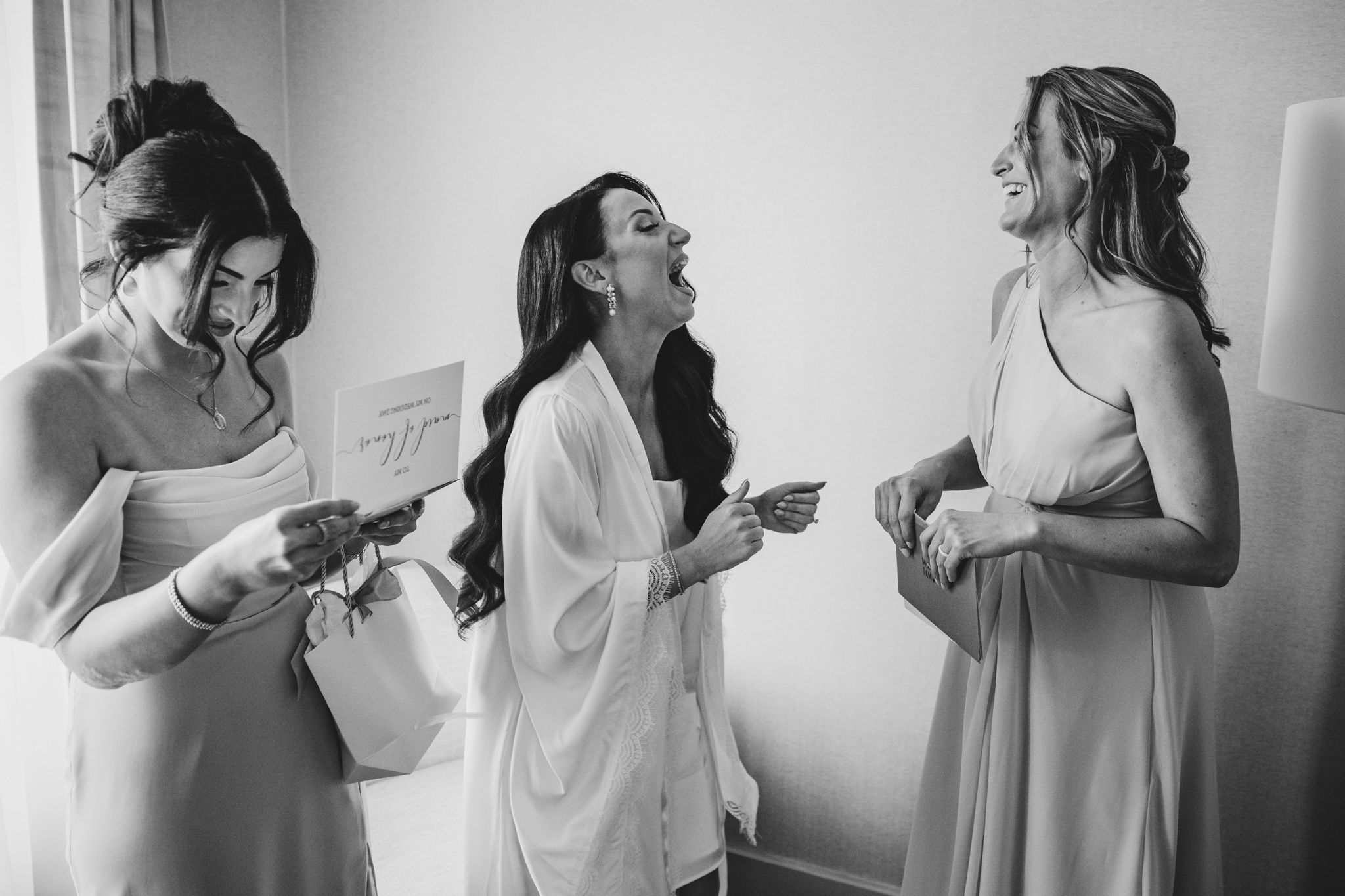 Black and white candid moments during wedding preparations.