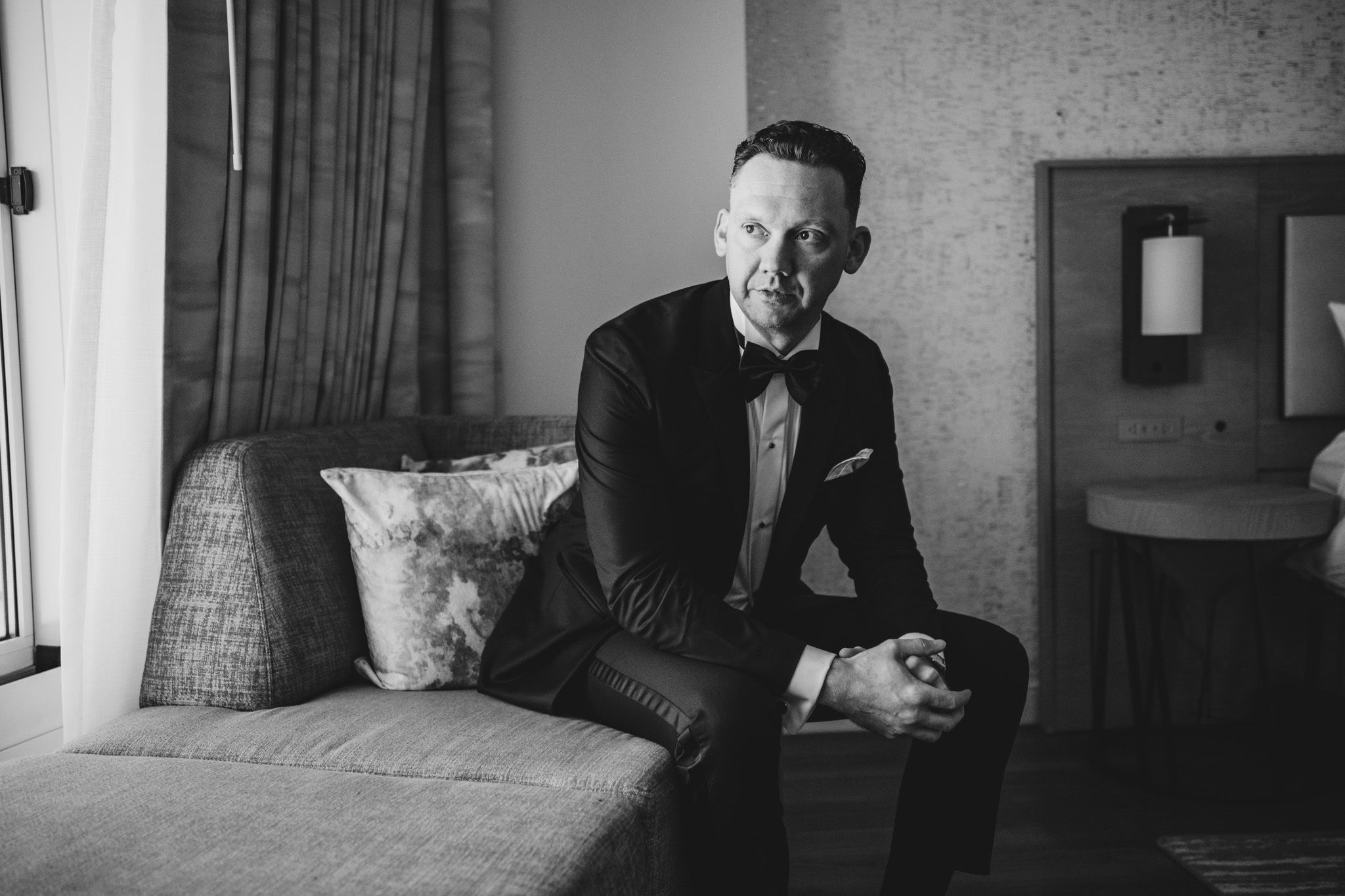 Black and white photos of people in formal wear preparing for an event.