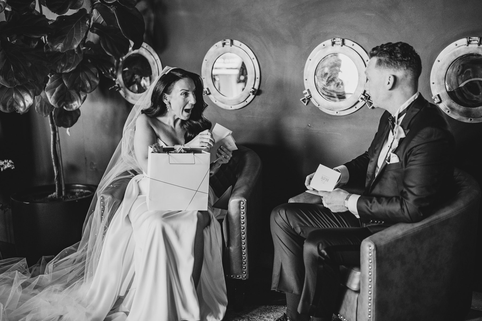 Black and white wedding reception photos showing couple's romantic moments among vintage decor.
