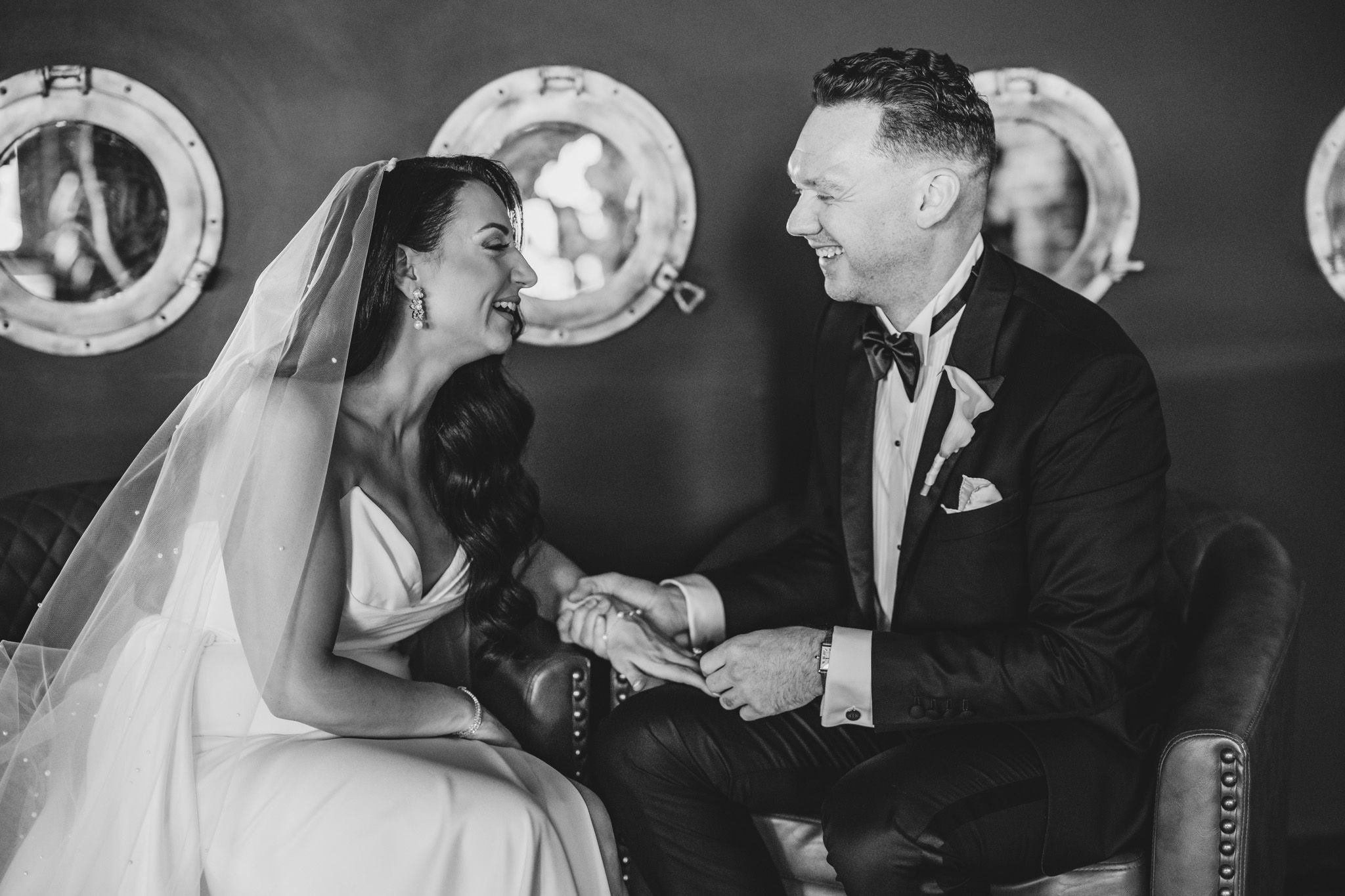 Candid black and white wedding photos capture intimate moments between couple at reception.