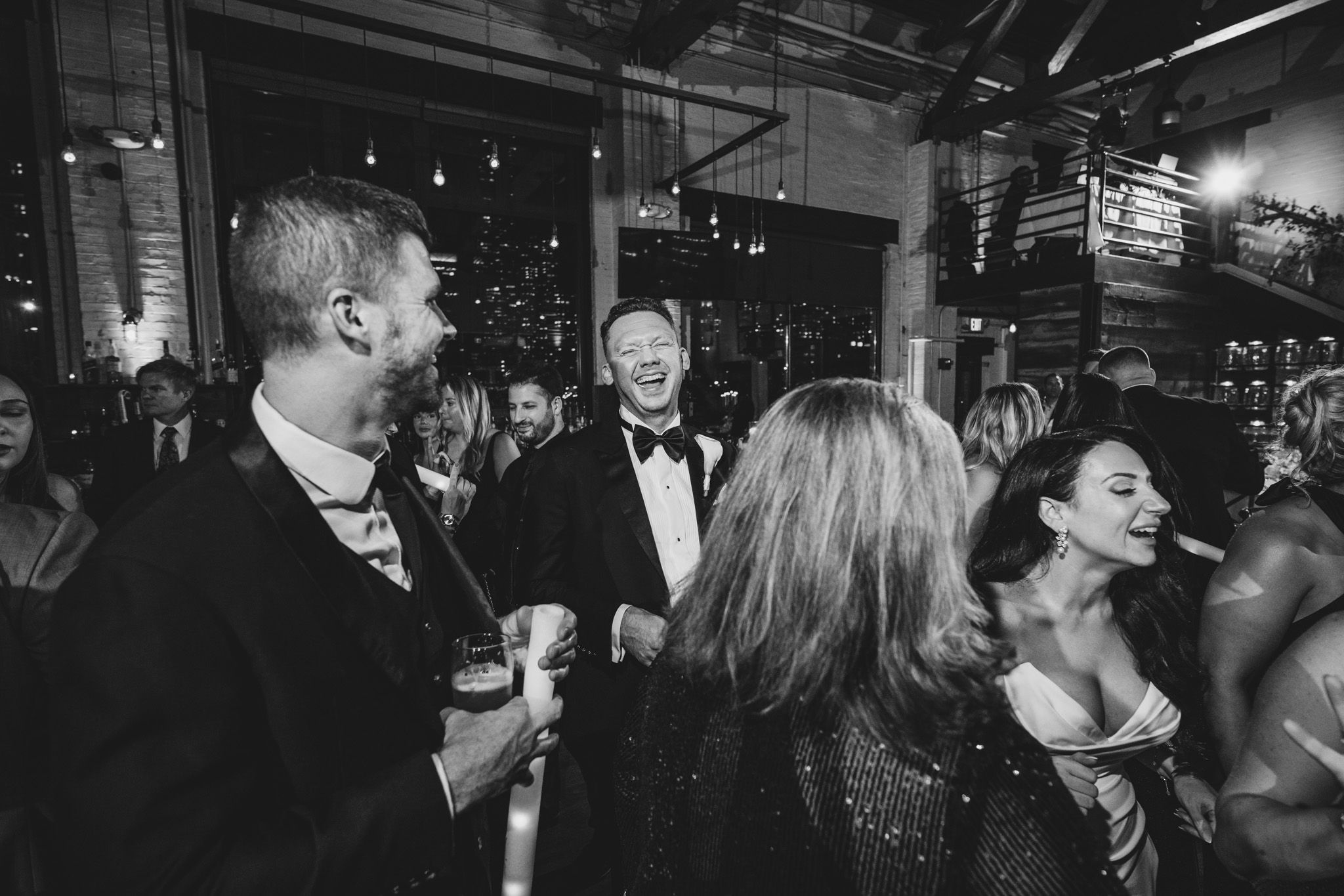 Guests enjoying themselves on a crowded dance floor at an upscale evening celebration.
