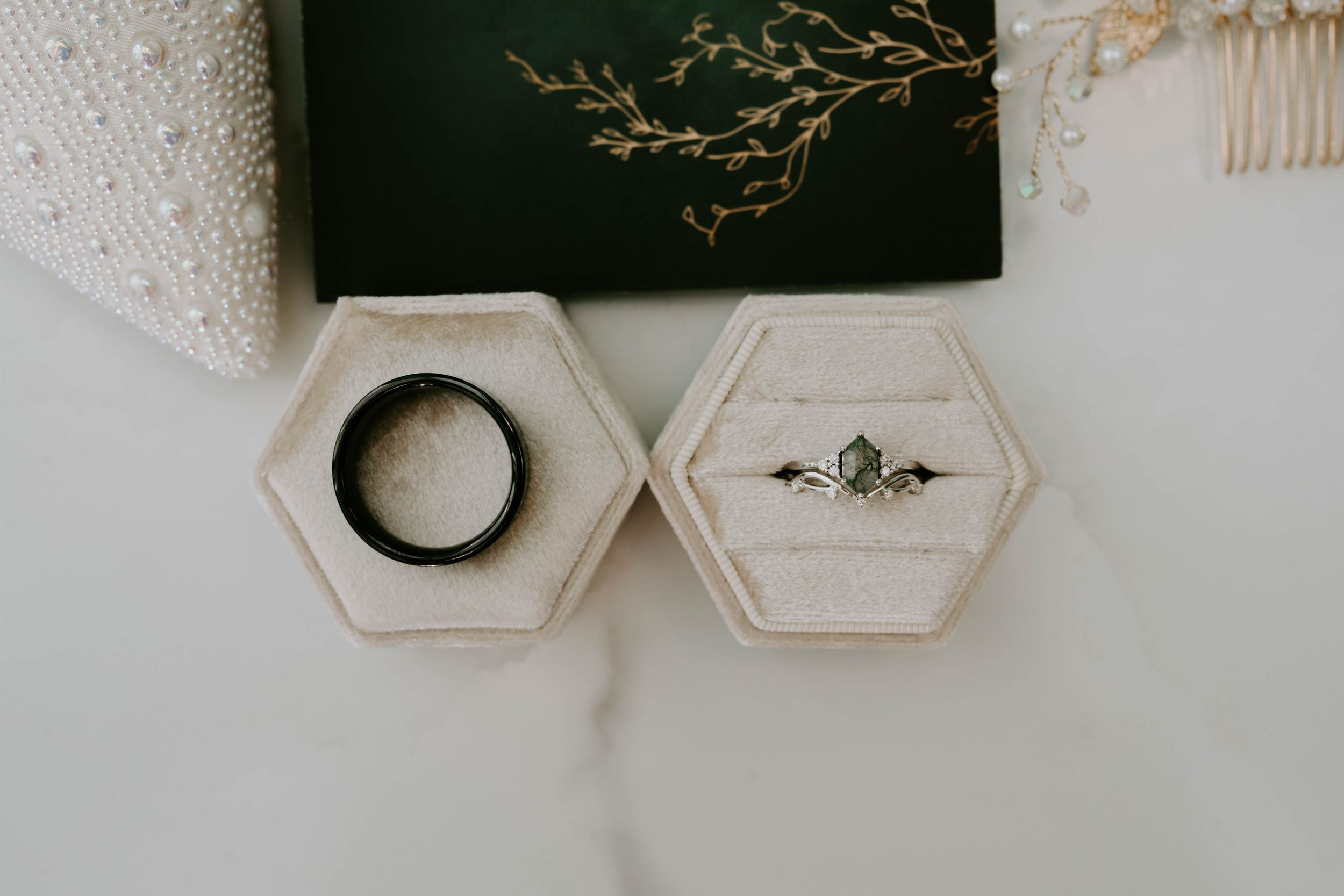 Minimalist wedding details featuring geometric shapes and delicate accessories on a light background.