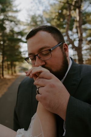 Series of close-up romantic moments between newlyweds in outdoor setting.