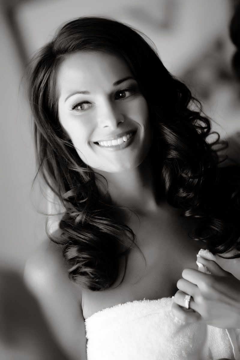 A black and white artistic portrait series showing soft expressions and flowing dark hair against a light background.