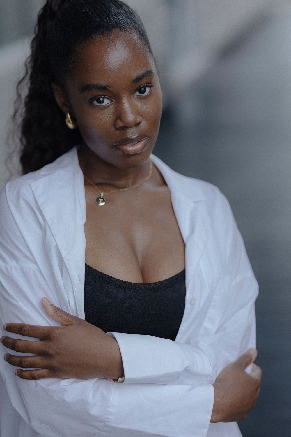 A series of close-up portraits showing someone wearing a white button-down shirt and black top against a blurred background.