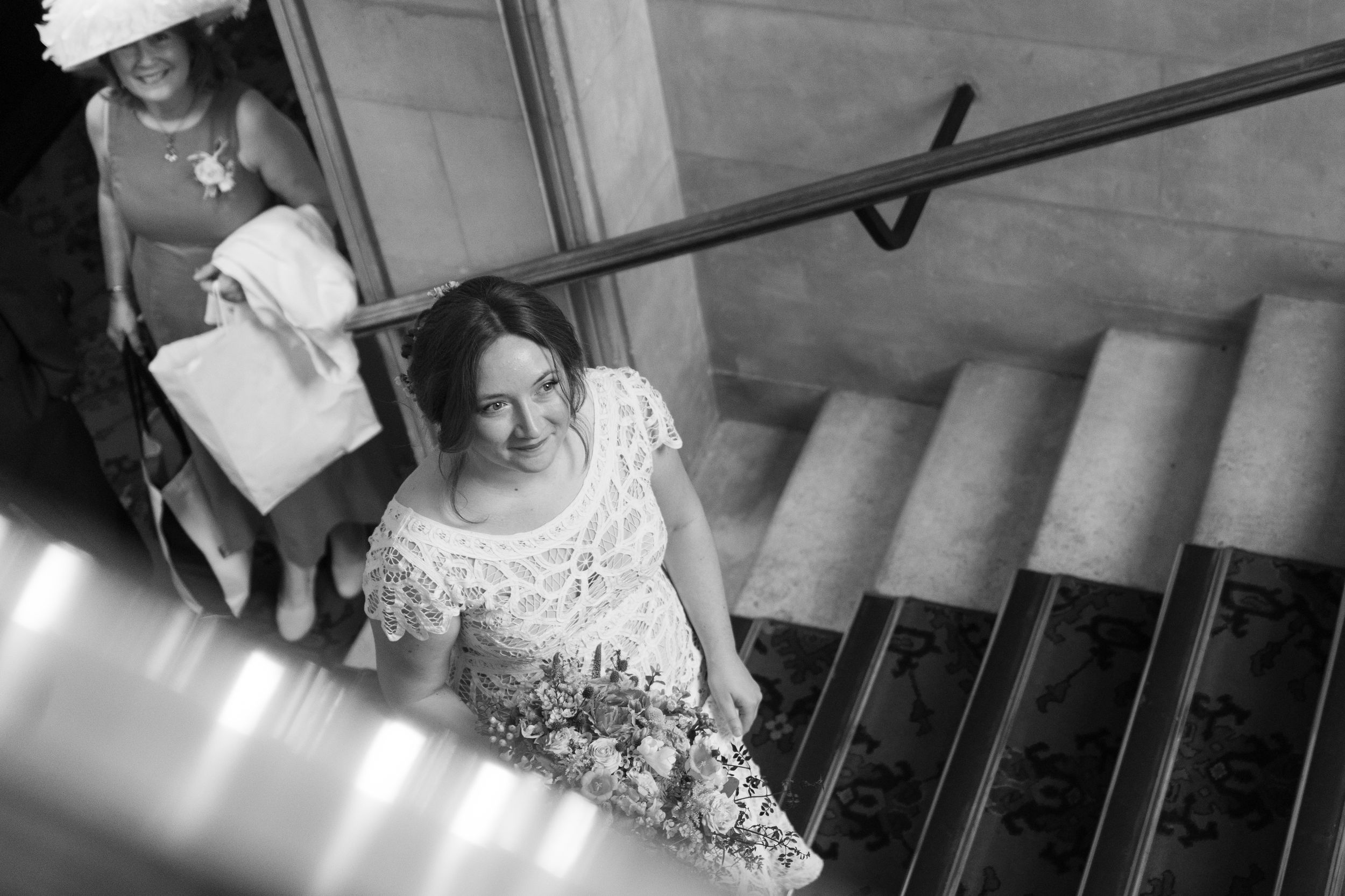 Wedding venue staircase decorated with elegant details and natural lighting.