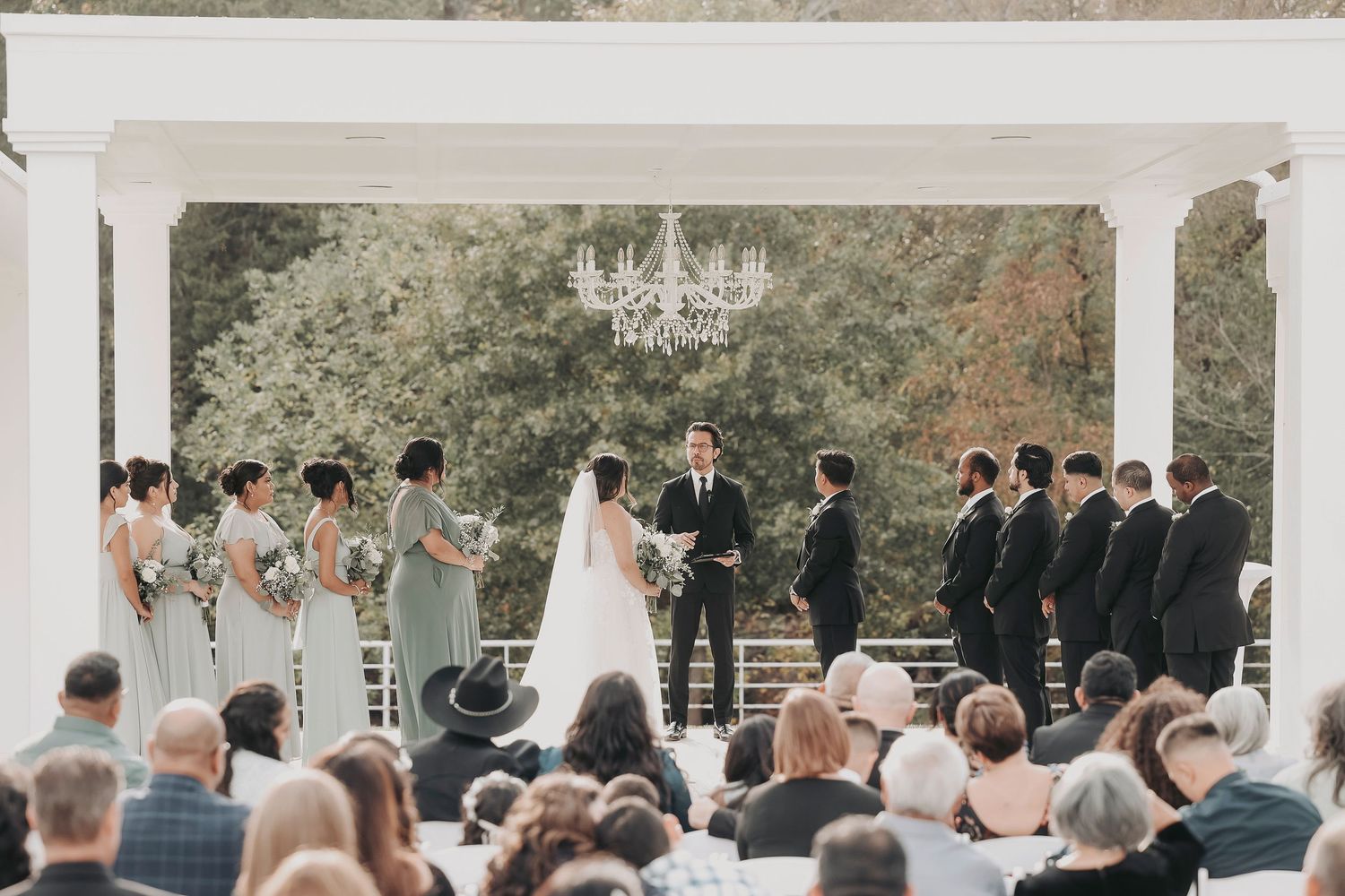 Romantic field wedding ceremony with golden light and emotional guest reactions