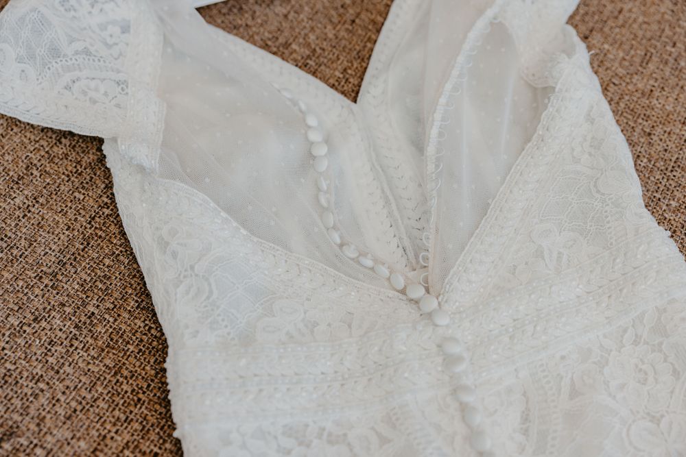 Back of wedding dress showing buttons and lace detail