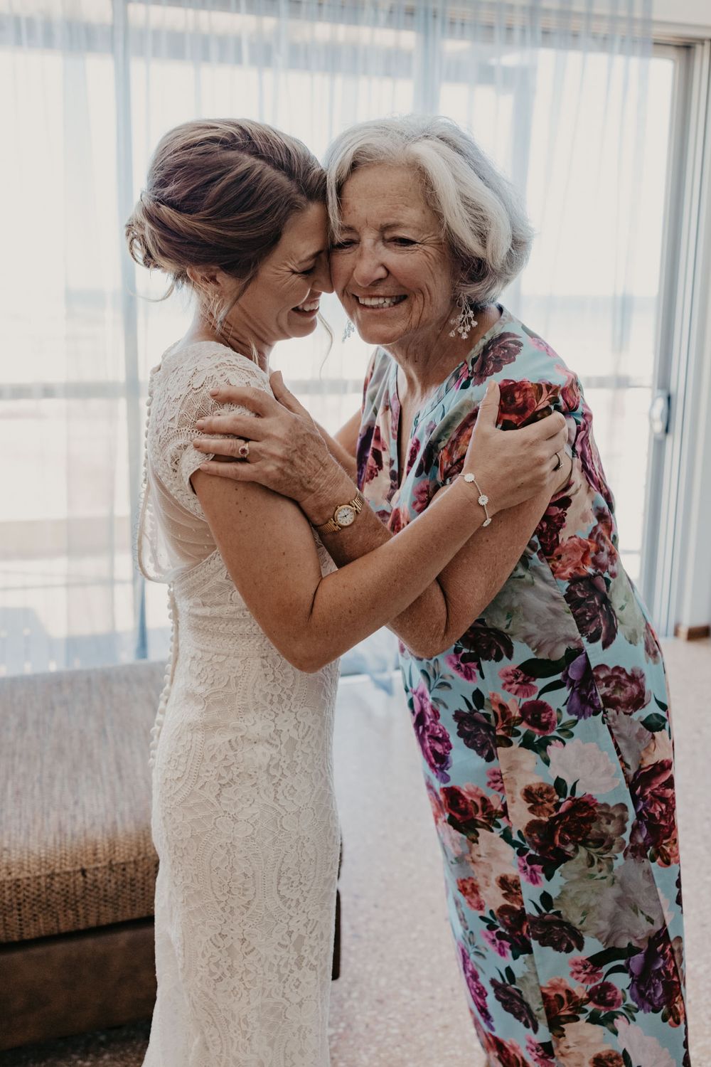 Bride and mother embrace in a heartfelt moment