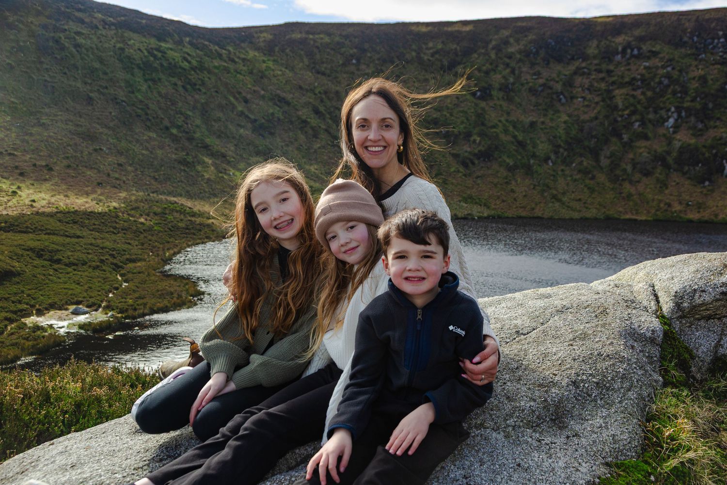 Happy family portrait taken while exploring the wicklow mountains on a day trip from dublin.