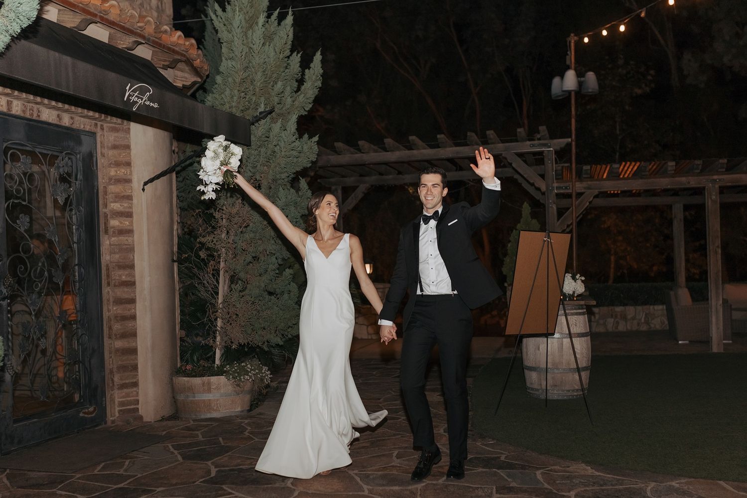 A couple enters their wedding reception together at Lake Oak Meadows in Temecula.