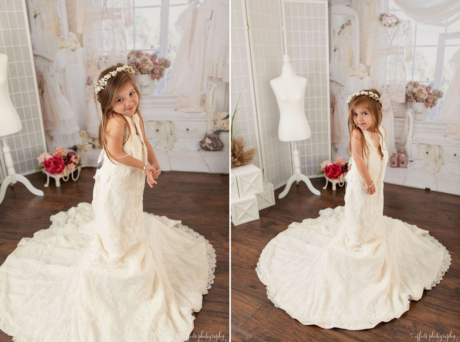 A beautiful white wedding dress with a flowing train is displayed in an elegant room with a dress form and floral decor.
