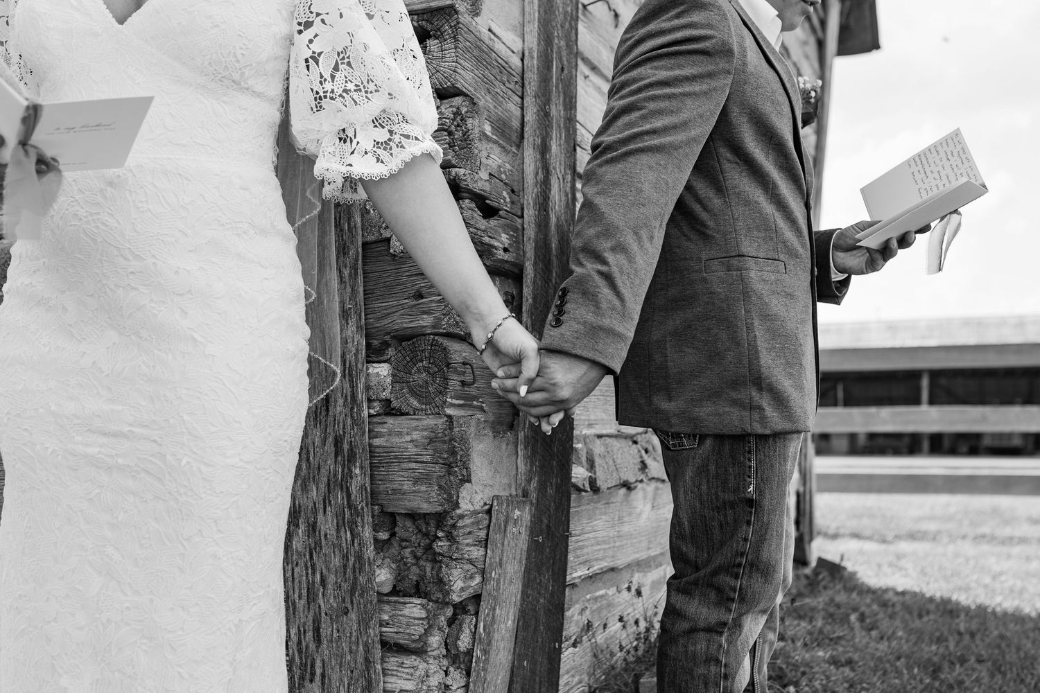 a bride and groom holding hands for their first touch while exchanging vows privately