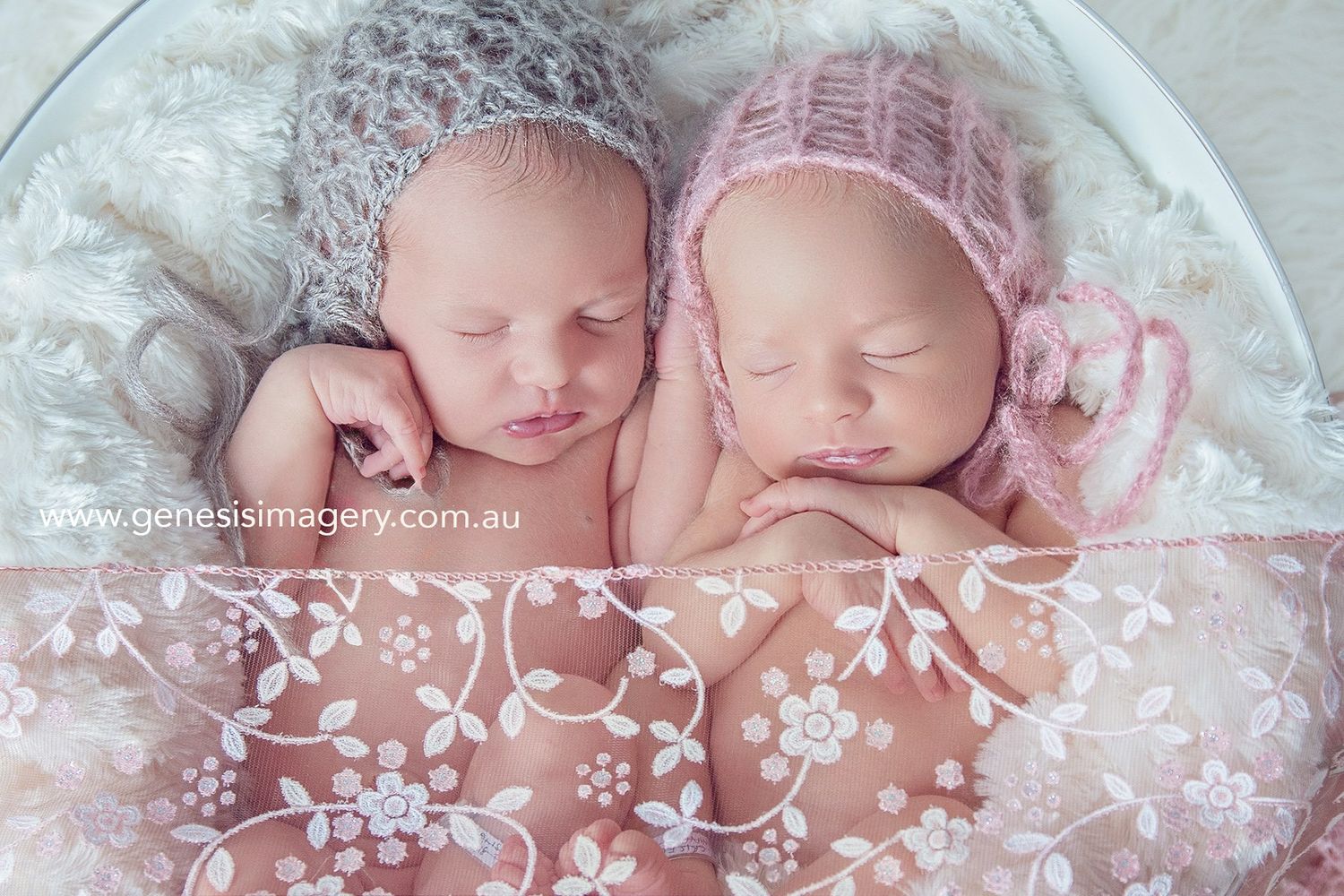 twin newborn photographer Gold Coast 
2 little sweet girl sleeping together posed sadly in a white bucket
