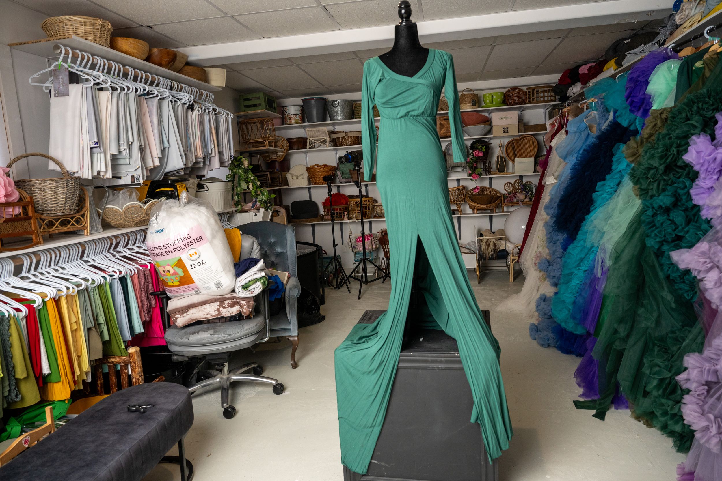 Hospital equipment and colorful scrubs line the aisles of a medical supply store with bright overhead lighting.