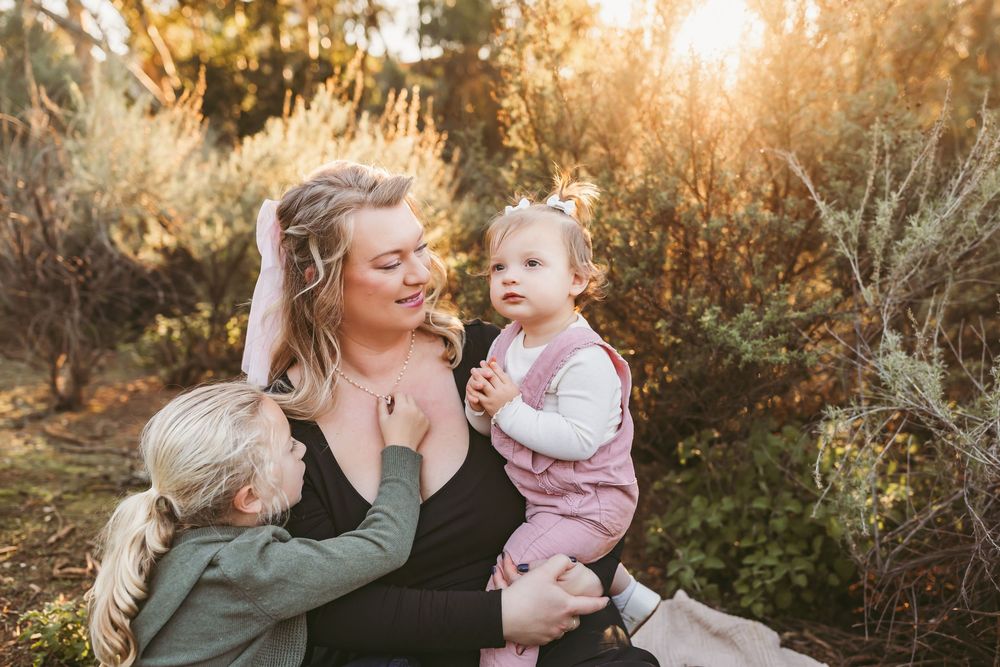 A collection of five outdoor family portraits at sunset showing tender moments between parent and child.