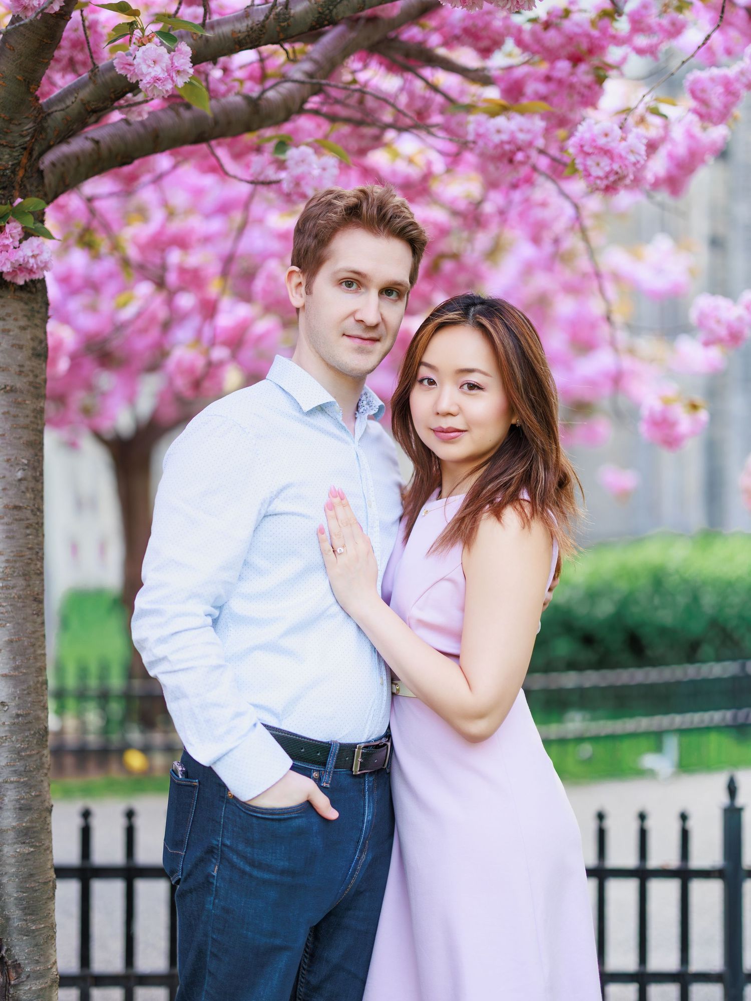 Couple portrait under cherry blossoms during a spring photo session in Toronto