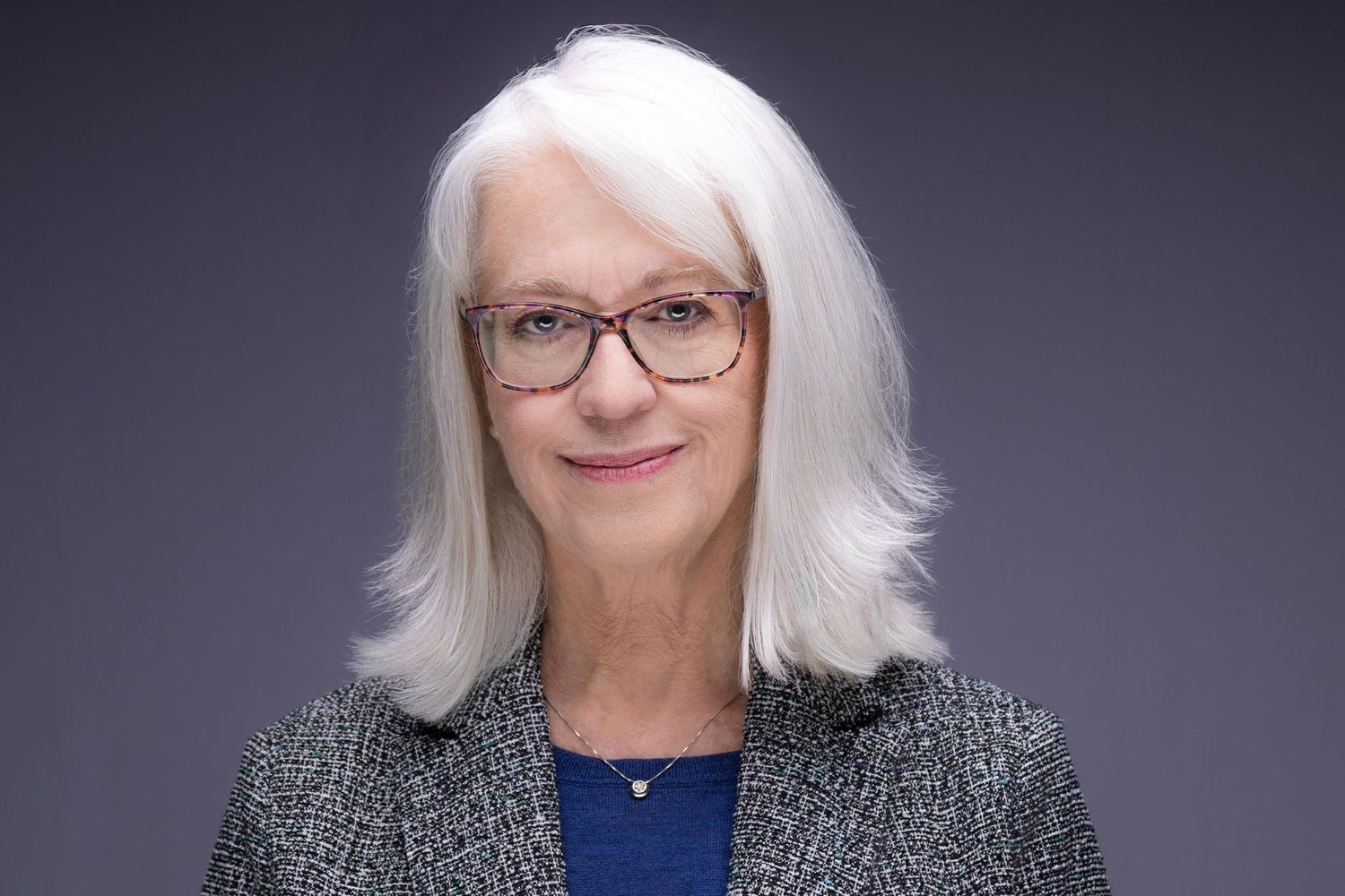 Clean studio headshot for a corporate professional