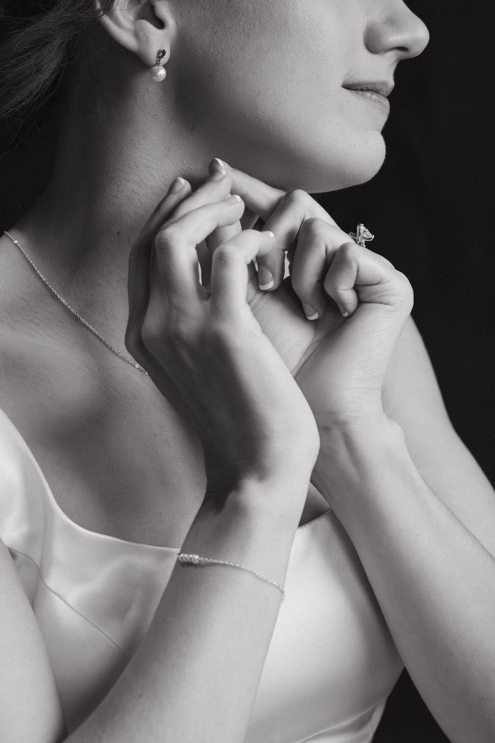 A series of black and white profile portraits showing an elegant neck and hand pose in dramatic lighting.