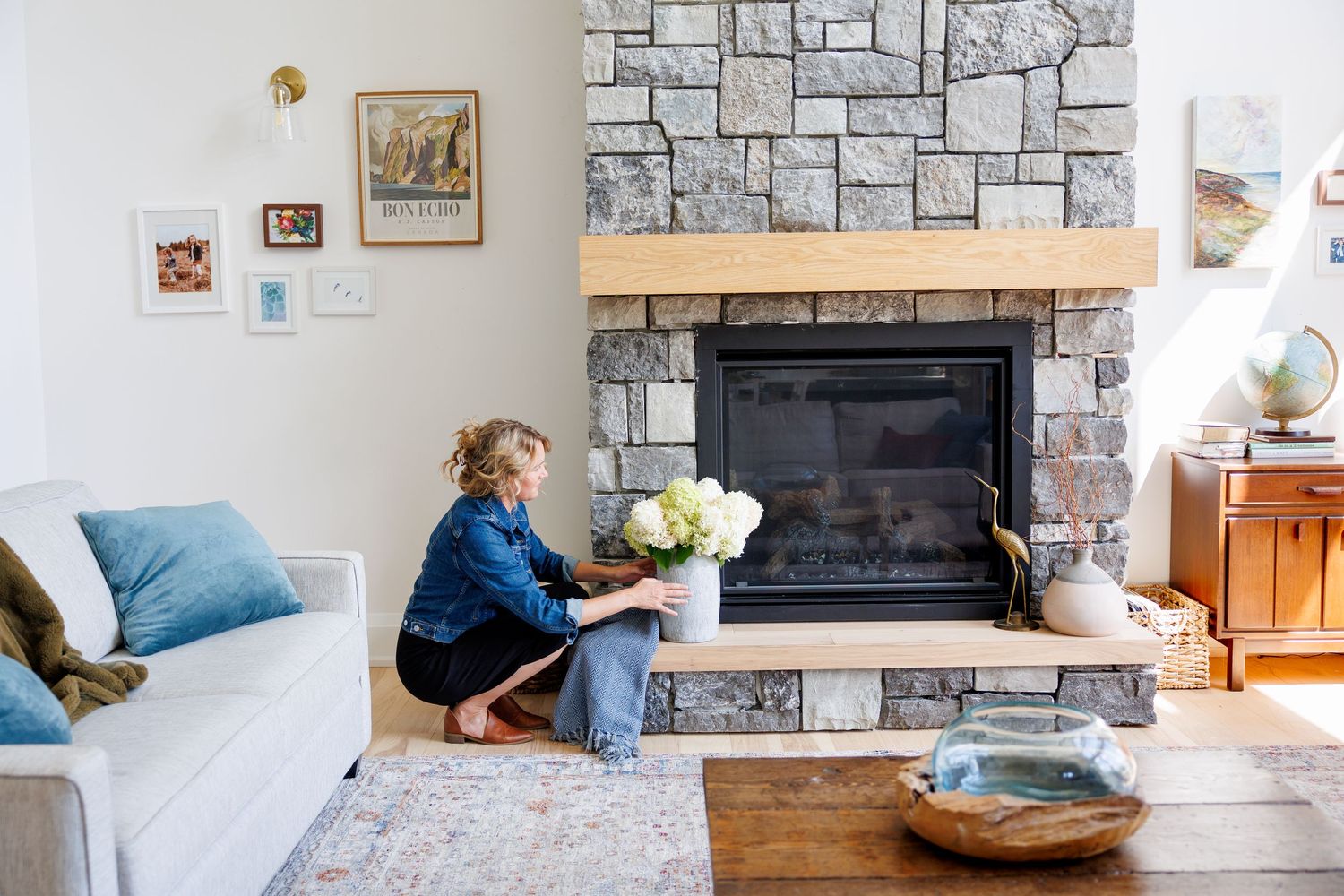 A collage of six interior photos showing stone fireplace renovations and living room updates in progress.