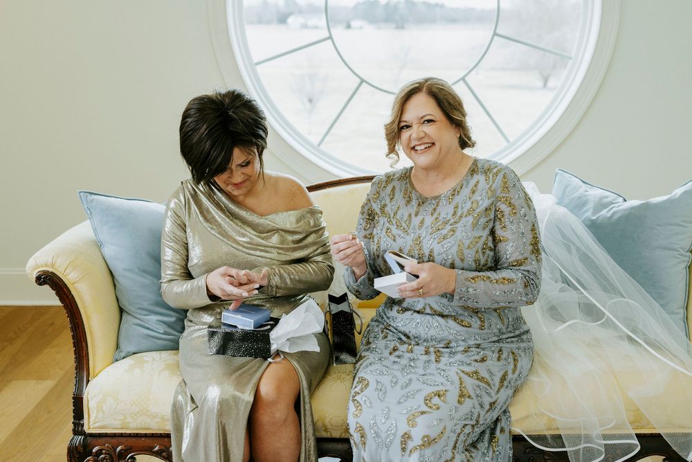 Intimate wedding preparation moments captured in a series of candid indoor photographs.
