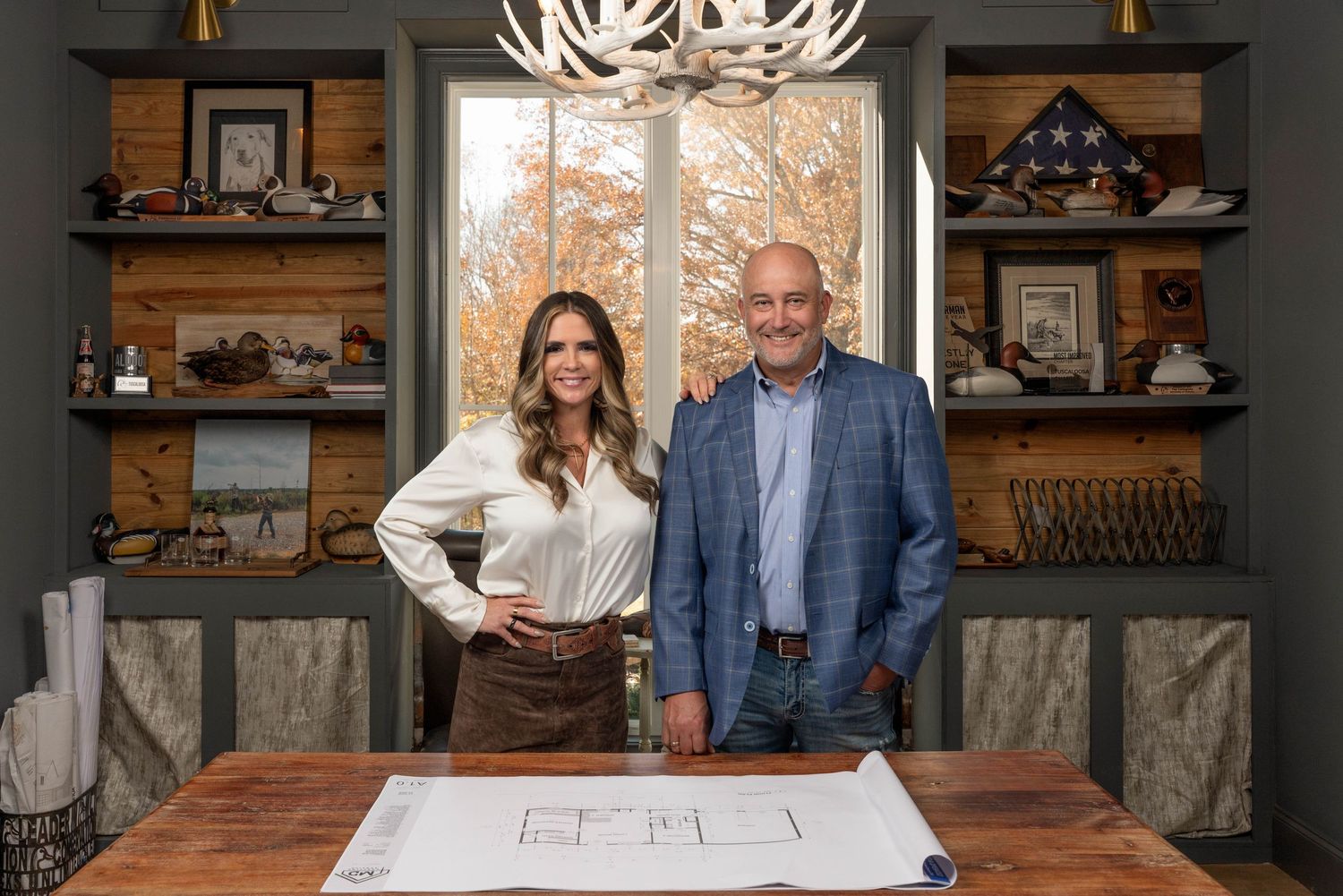 Headshot of a couple looking prestigious in an office