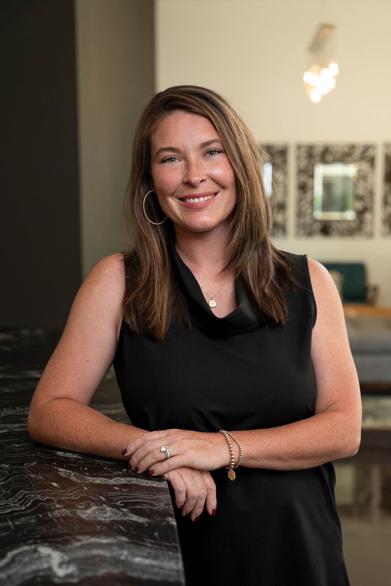 female real estate agent smiling at the camera